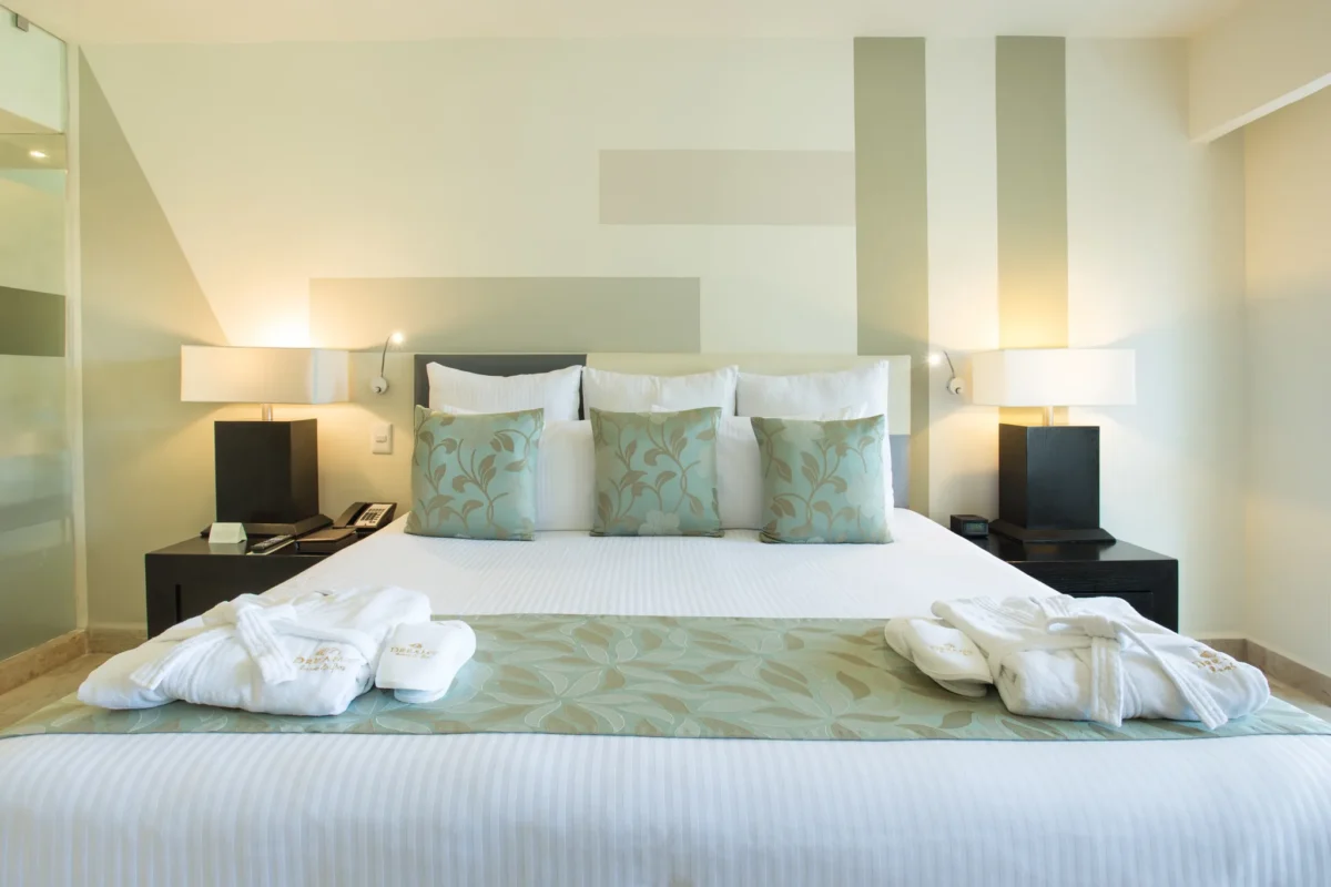 Deluxe Partial Ocean View king room with contemporary décor at Dreams Sands Cancun Resort & Spa.
