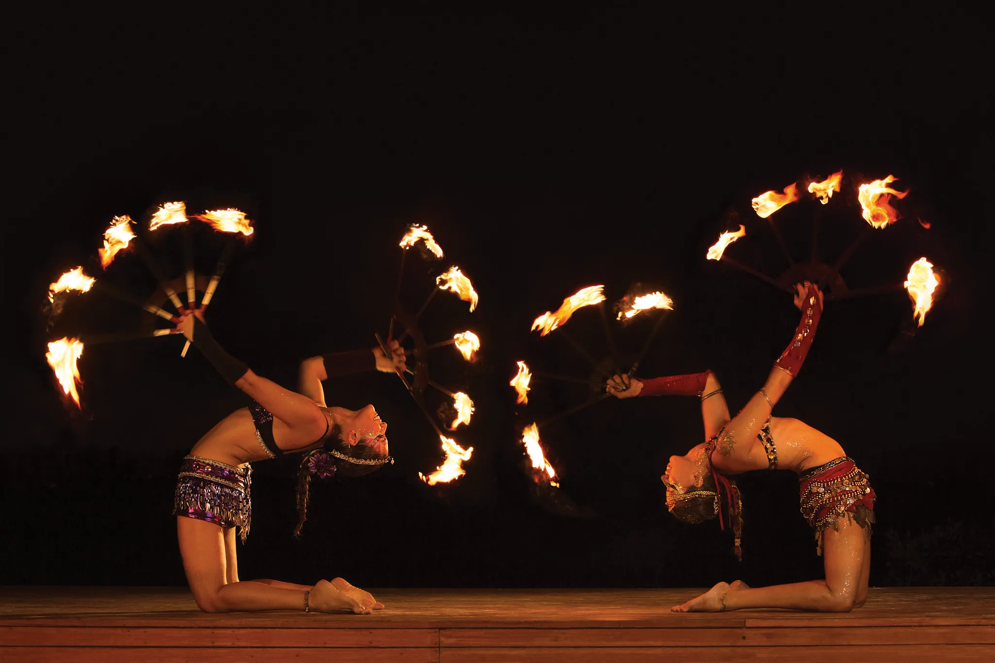 Fire performers entertaining guests during a nighttime show at Dreams Sands Cancun Resort & Spa.