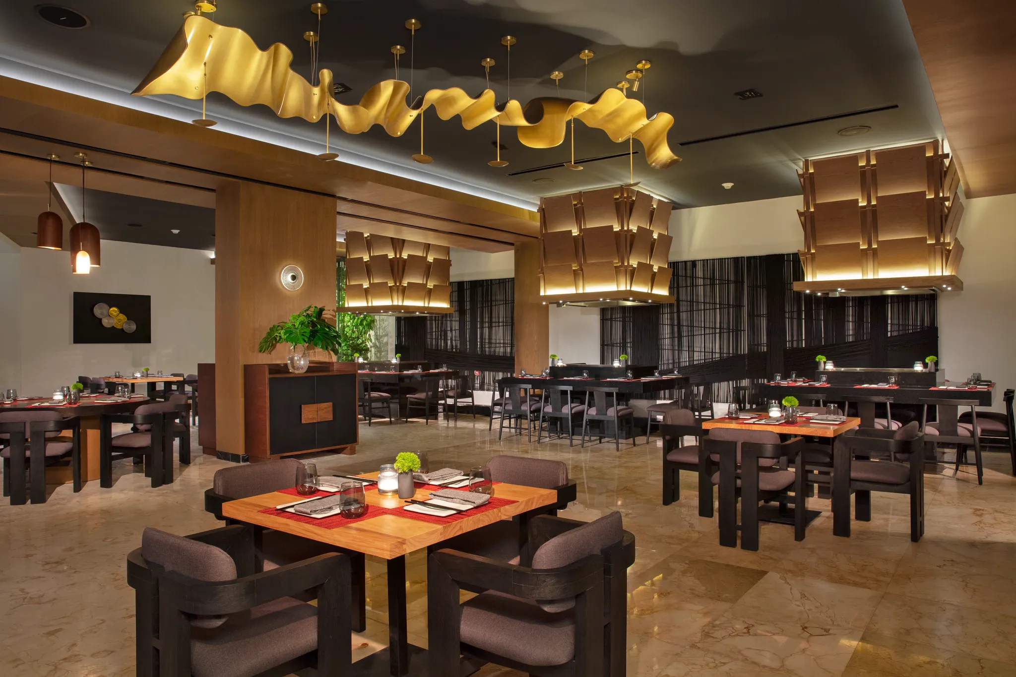 Himitsu restaurant at Dreams Sands Cancun Resort & Spa featuring elegant Asian-inspired décor, sushi selections, and teppanyaki dining experience.