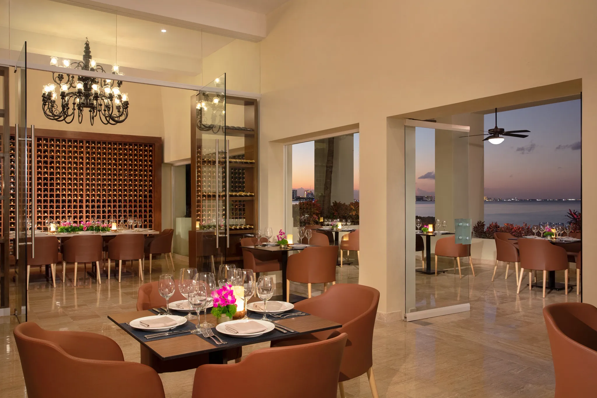Portofino restaurant at Dreams Sands Cancun Resort & Spa featuring elegant Italian dining, refined table settings, and romantic ambiance.