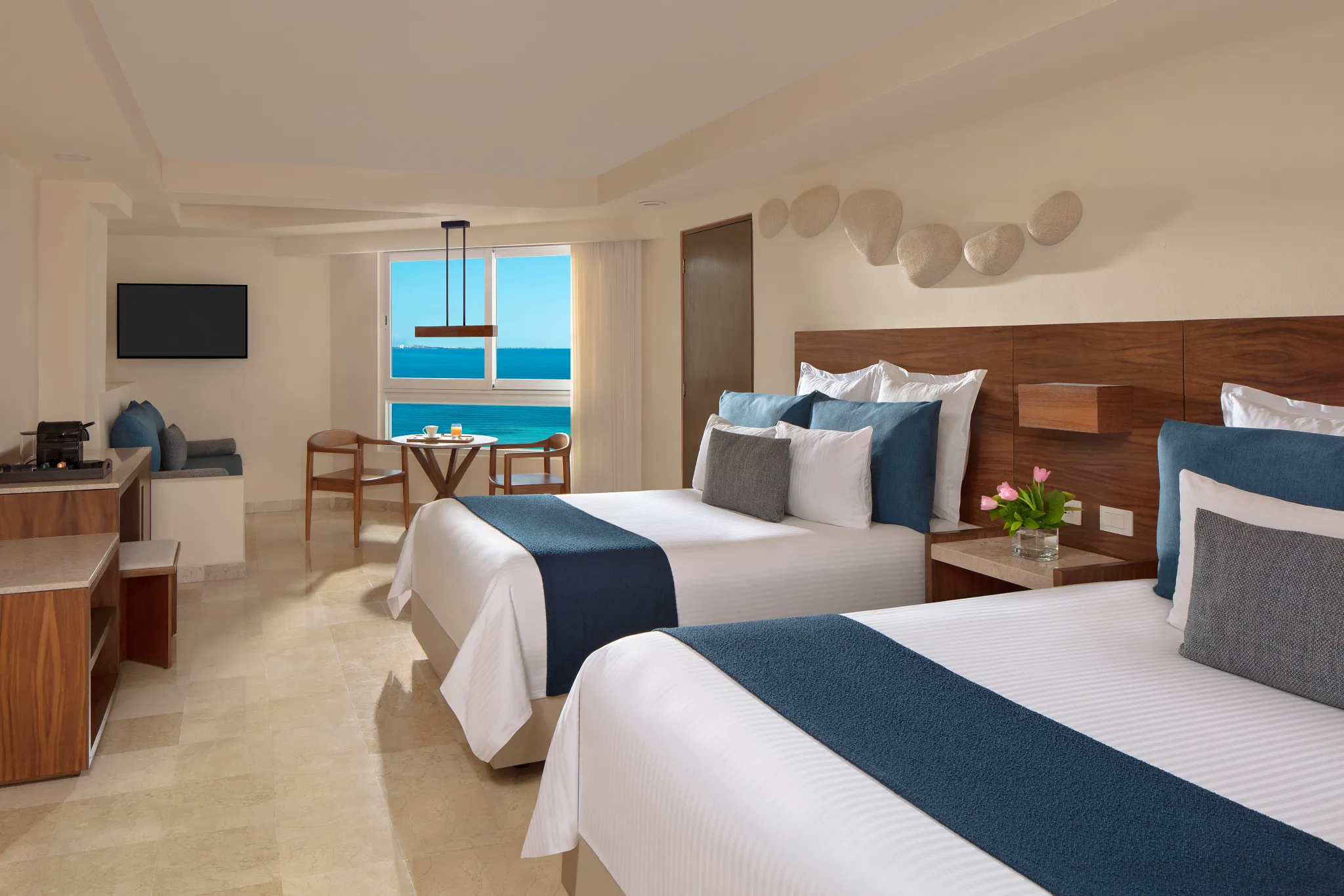 Preferred Club Family Suite with double beds and oceanfront views at Dreams Sands Cancun Resort & Spa.