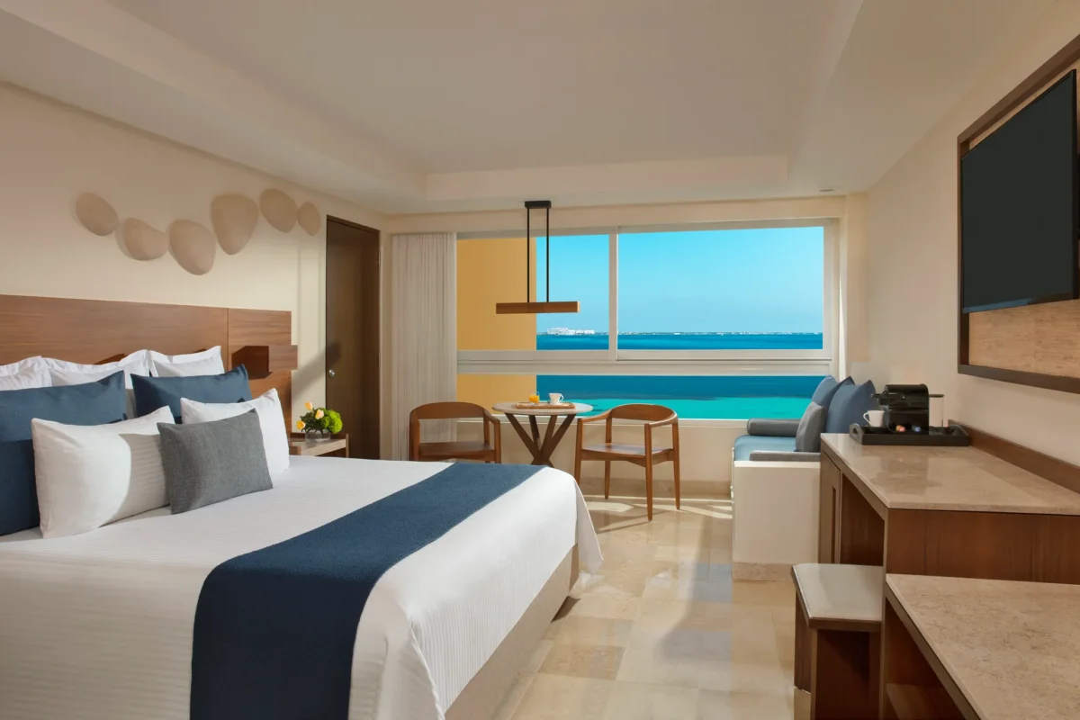 Preferred Club Family Suite king room with oceanfront views at Dreams Sands Cancun Resort & Spa.