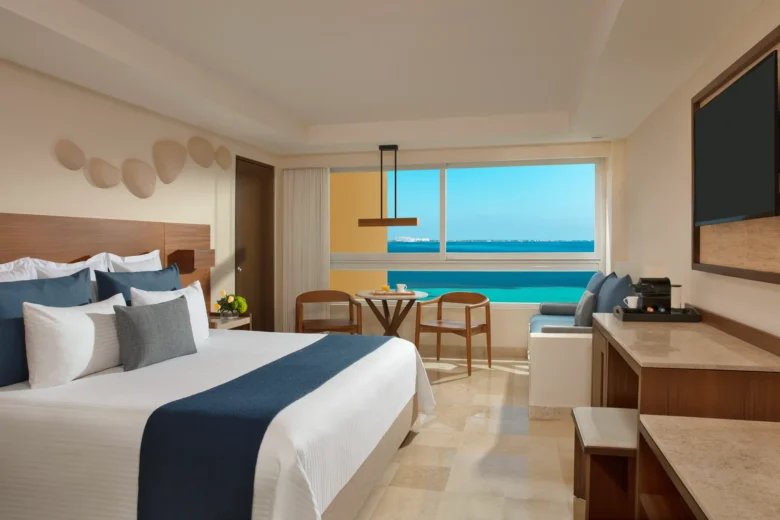 Preferred Club Family Suite king room with oceanfront views at Dreams Sands Cancun Resort & Spa.