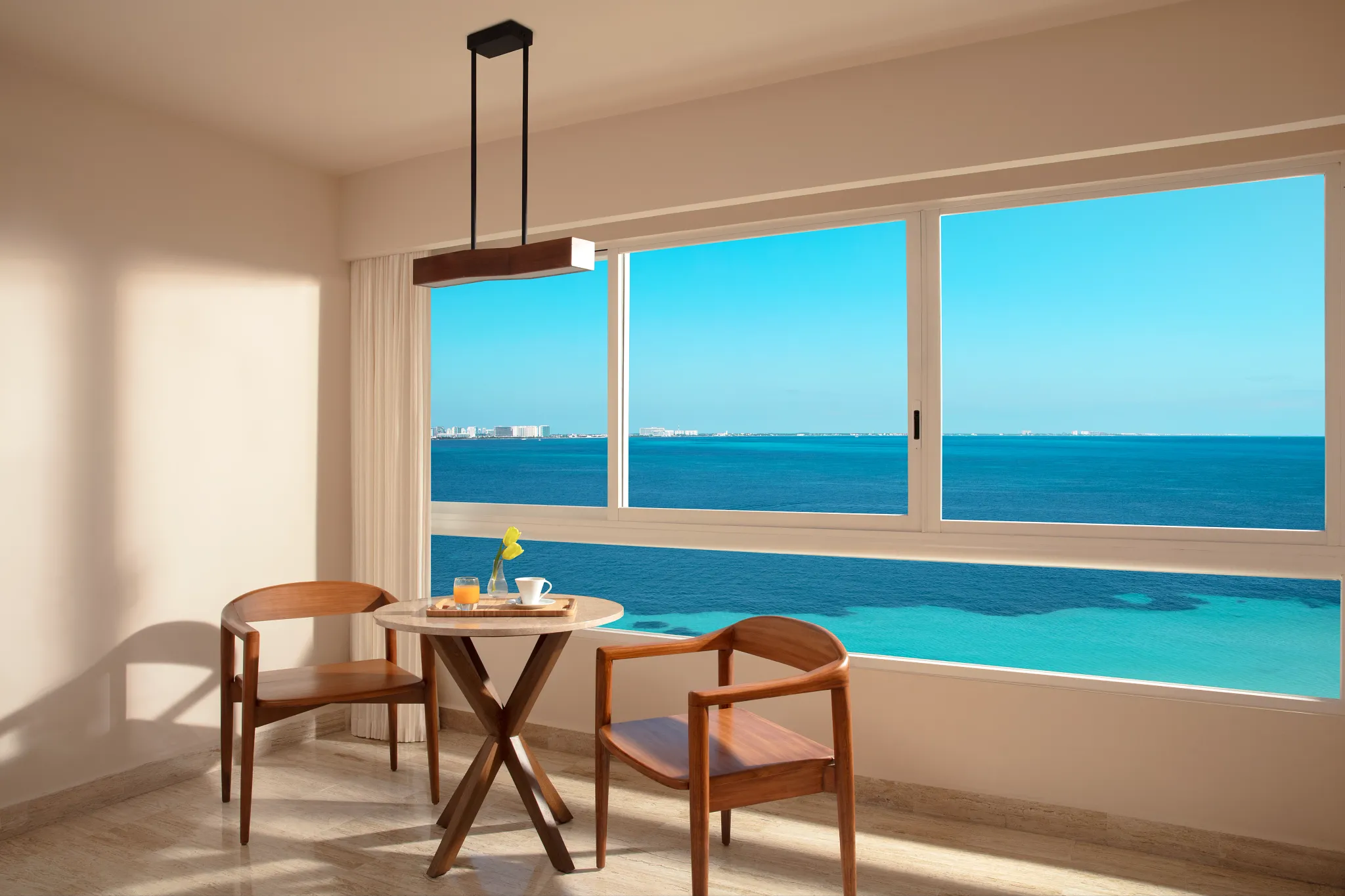 Preferred Club Ocean Front dining area with panoramic Caribbean Sea views at Dreams Sands Cancun Resort & Spa.