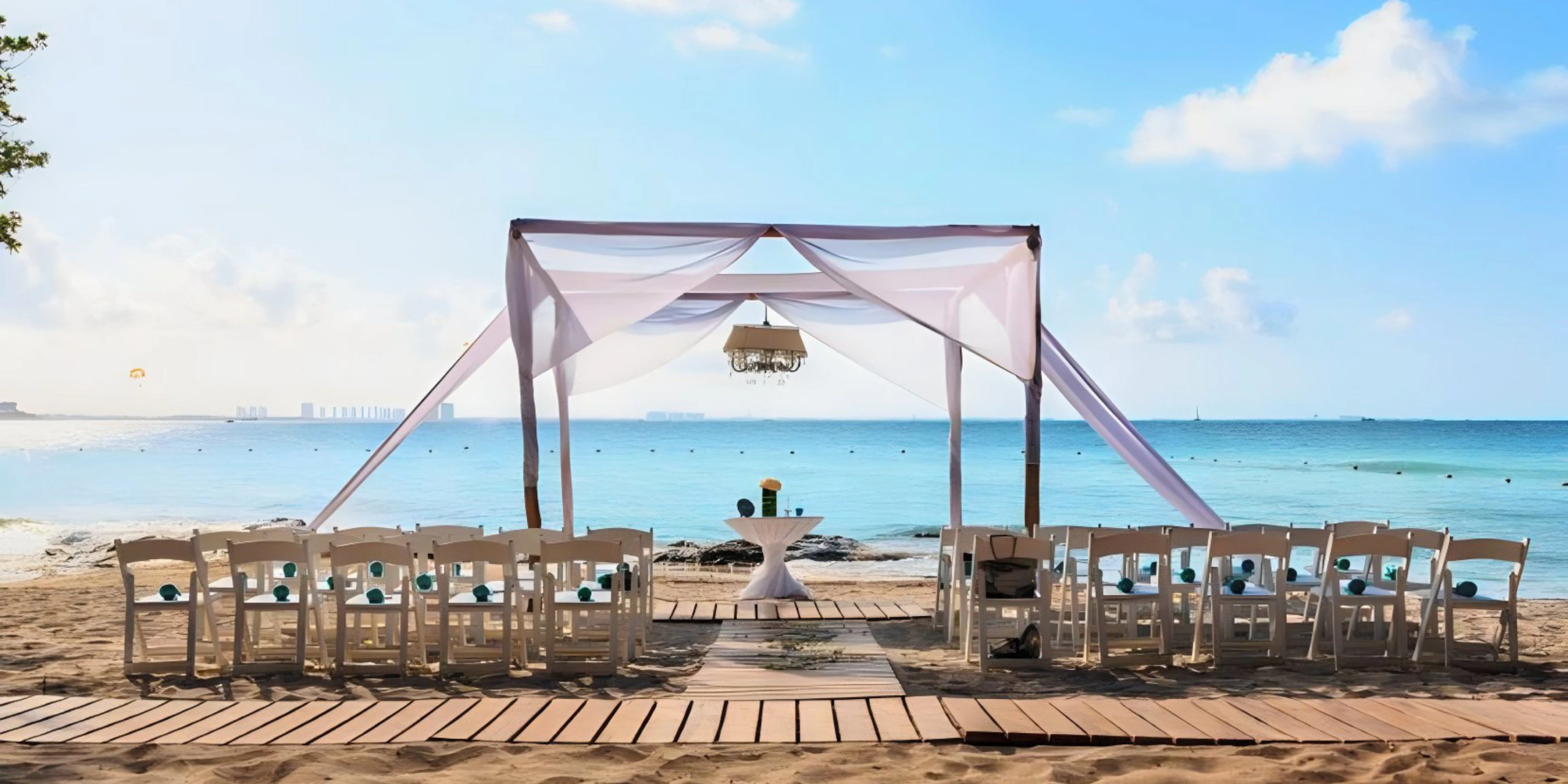 Waves and Sands beachfront wedding setup at Dreams Sands Cancun Resort & Spa